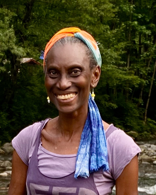 Portrait of Layo Oladapo Fasan, nutritional therapist and founder of PhiNutriomics, standing outdoors in a natural setting